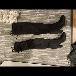 Over the knee black boot heels